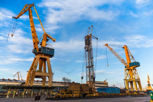 Large cranes built on construction site.